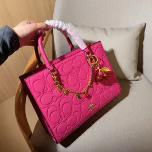 Coach Maggie’s embossed tote hand bags