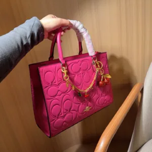 Coach Maggie’s embossed tote hand bags