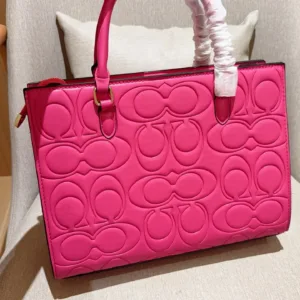 Coach Maggie’s embossed tote hand bags
