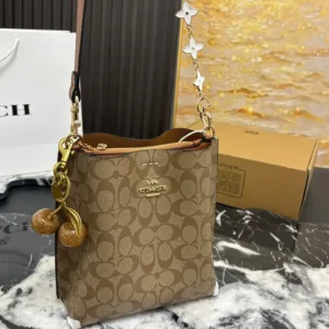 Coach’s latest Mollie bucket tote hand bags