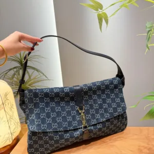 Gucci Supreme denim shoulder bags